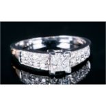 18ct White Gold Diamond Ring Set With 4 Central Princess Cut Diamonds Between Pave Set Round