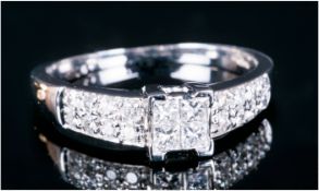 18ct White Gold Diamond Ring Set With 4 Central Princess Cut Diamonds Between Pave Set Round