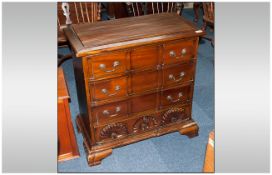 Reproduction Mahogany Small Size Chest of Drawers with a carved block front, Rhode Island