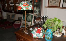 Leaded Glass Table Lamp In The Tiffany Style with a floral design shade on a gilt metal base. 28''