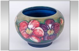 William Moorcroft Signed Footed Bowl 'Clematis' Pattern On Green/Blue Ground. Potter To H.M The