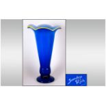 Modern Glass Vase, Royal Blue with yellow wavy rim to top. Signed Sandra Rich. 15 inches in height.