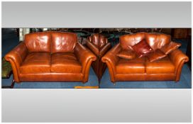 Matched Pair of Brown Leather Wing Armed Settee's with a Shaped Back with Loose Back and Seat
