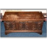 Small Carved Front Oak Coffer with Lift Up Lid, The Panel Carved In The Gothic Manner on Bracket