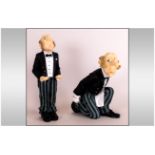 A Pair of Hand Painted Comical Butler Resin Figures. Heights 9 & 6.5 Inches.