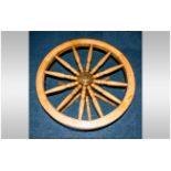 Cog Wheel Coffee Table with a glazed top on turned spindle legs, 36 inches in diameter.