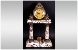 French Reproduction Marble Clock with 2 Corinthian columns holding a round clock dial. Gilt metal