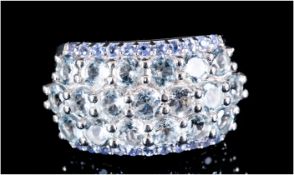 Aquamarine and Tanzenite Wide Band Ring, three rows of sparkling, round cut aquamarines, with a