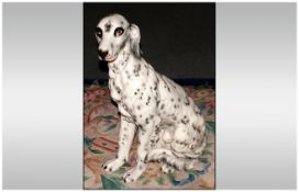 A Good Quality Realistic Life-Size Ceramic Figure of a Fireside - Seated Dalmation Dog. 30 Inches