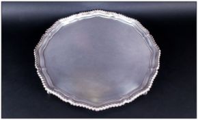 Elizabeth II Good Quality Very Large Circular And Shaped Silver Footed Salver, with gadroon border &