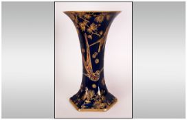 Crown Ducal Lustreine Vase with a prussian blue body with a gilded decoration of humming birds, 10