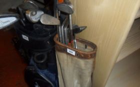 Old Style Golf Bag With Some Clubs