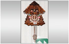 German Black Forest Musical Triple Weighted Cuckoo Clock Of Typical Form With Painted Floral