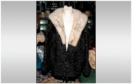 Ladies Black Curled Lamb Jacket, with mink collar, fully lined. Slit pockets & cuff sleeves,