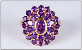 Amethyst Oval Cluster Ring, two rows of purple amethysts, one of oval cuts and one of round, framing