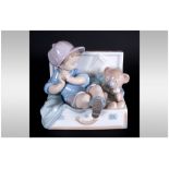 Lladro Figure 'My Favourite Place' boy & teddy in suitcase. Model number 67958, sculpture Joan