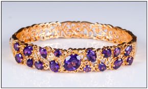 Amethyst Art Nouveau Style Filigree Bangle, a variety of cuts of deep purple amethyst, oval, pear