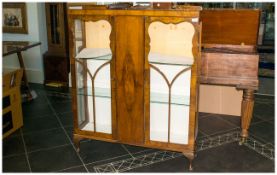 Edwardian Walnut Double Door Display Cabinet with astral glazed doors. with shaped back top rail