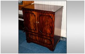 Modern TV Cabinet in mahogany finish.