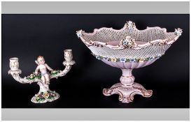 Dresden Porcelain Two Branch Candlestick with winged putto to the centre, 12'' in width, 8'' in
