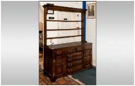 Edwardian Oak Welsh Type Dresser & Rack The base with side cupboards and three central drawers,