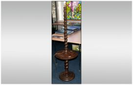 1920's Candy Twist Oak Lamp Stand with a Central Shelve on Turned Round Base. 62 Inches High.