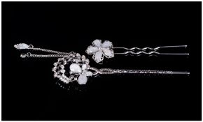 Two White Crystal Hair Ornaments, one a large pin with a curved branch of Austrian crystal leaves