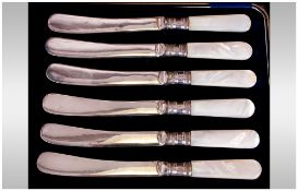 Boxed Set of Six Silver Banded and Mother of Pearl Handled Butter Knives.