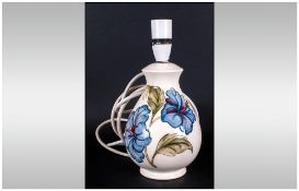 Moorcroft Lamp Base, 'Blue Hibiscus' on a cream ground; 8 inches high; excellent condition