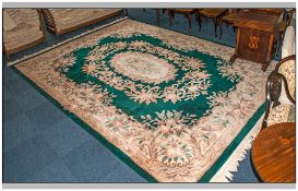 Large Room Woolen Size Rug, cream floral embossed decoration on green ground. Good Quality.