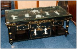 Chinese Black Lacquered Low Table with a glass top, onlaid with carved figures of traditional ladies