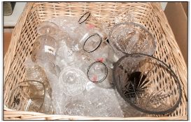 Wicker Basket containing an assortment of glass including tumblers, wine and champagne glasses,