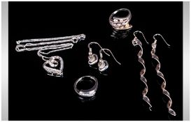 Small Lot Of Silver CZ Set Jewellery, Comprising 2 Rings, Pendant And Earring Set And A Pair Of