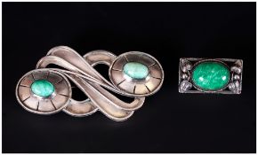 Art Nouveau Silver Brooch set with two cabochon cut green stones; 2.75 inches high, plus a further