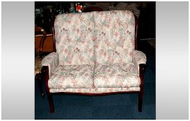 Modern Two Seater Mahogany Framed Parlour Settee, upholstered backs and seats in a floral tapestry