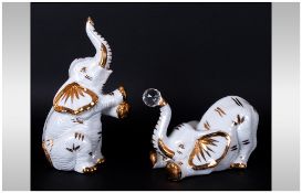 Capodimonte and Swarovski Pair of Polaris Elephant Figures. Hand finished In Gold 7 Inches High.
