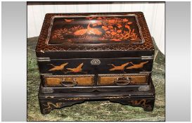 Japanese Lacquer Table Casket On Stand, decorated with flying crane birds amongst foliage. Fitted