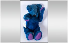 Blue Plush Teddy Bear with glass eyes. Worn Condition. 12 ''in length.