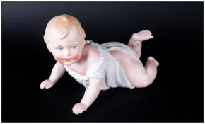 Gebruder Heubach 19th Century Piano Baby Bisque Figure. c.1880's. 5.5 x 8 Inches.