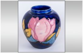 Moorcroft Small Vase 'Magnolia' Design on blue ground.  Circa 1970's 3.75'' in height, excellent