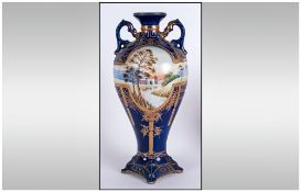 Noritake Two Handle Hand Painted Vase. c.1910. Overlaid with Gold Decoration on Blue Ground.