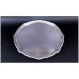 Elizabeth II Good Quality Very Large Circular And Shaped Silver Footed Salver, with gadroon border &