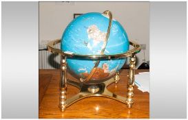 World Gem Globe, tilt and swivel, set in four legged brass stand