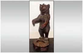 19th/20thC Black Forest Carved Figure In The Form Of A Standing Bear Raised On A Carved Leafy Base,