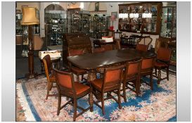 1930's Profusely Carved 17 Piece Oak Dining Room Suite, consisting of an extending drawer leaf table