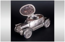 German Silver Plated Inkwell, in the form of a car, with a hinged lid exposing a glass inkwell.