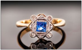 Ladies Early 20thC Diamond Ring, Set With A Central Blue Calibre Cut Stone Between Four Round