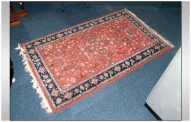 Indo Persian Small Size Rug with a rust coloured ground with a floral decoration. 60x36''