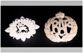 Carved Ivory R.A.F Brooch together with carved ivory bravaman stag brooch.