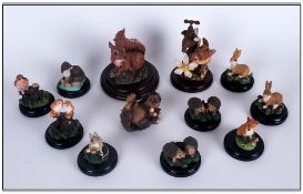 Collection Of 11 Miniature Animal Figures On Bases Together With A Hedgehog